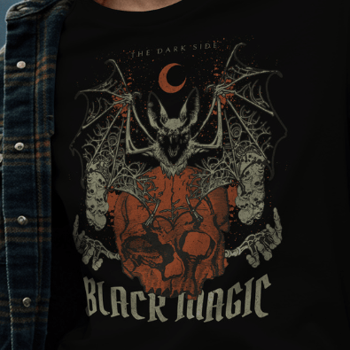 Close Up - Front View
Black t-shirt with a bat and skull design and 'Black Magic' text, worn by a person.