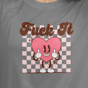 Close Up- Front View
T-shirt with a cartoon heart character and text on a gray background