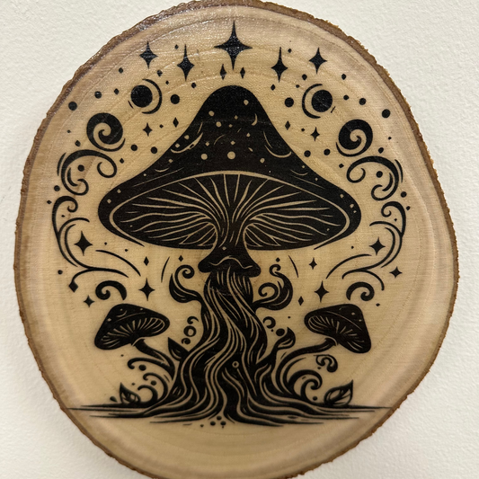 Close Up - Top View
approximately 9"- 10" wooden round, slice with black mushroom design and decorative elements on a white background