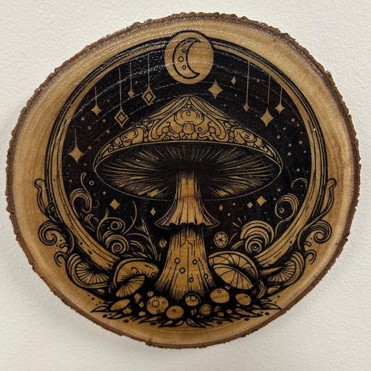 Close Up - Top View
Close-up detail of magical mushroom night laser engraving on birch wood round
