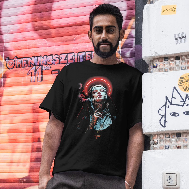 Man wearing a black t-shirt with a graphic design in front of a colorful mural.