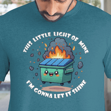 Close up of Graphic worn by a model.
Person wearing a teal t-shirt with a graphic of a dumpster fire and text.