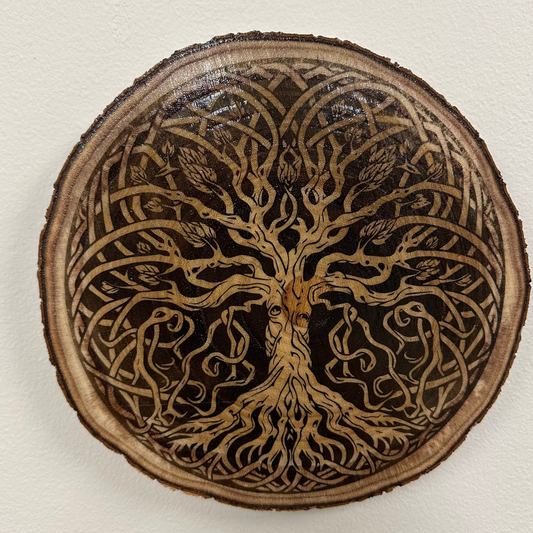 Close Up - Top View
Round-Wooden plaque with tree of life design on a white background
