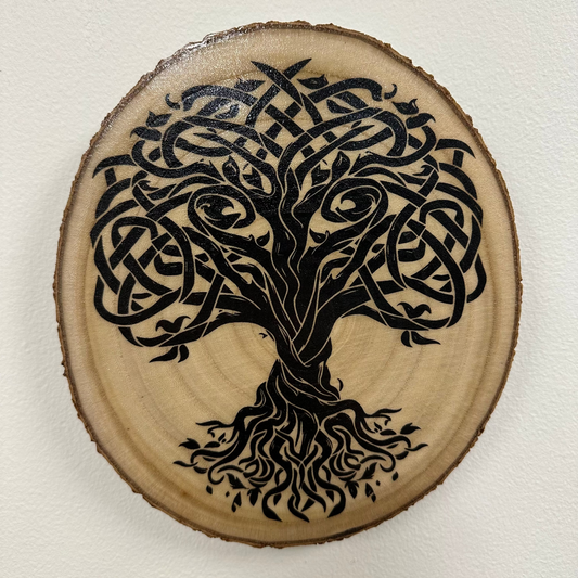 Close Up - Top View
Round, Burch wooden slice with a black Tree Of Life design on a white background