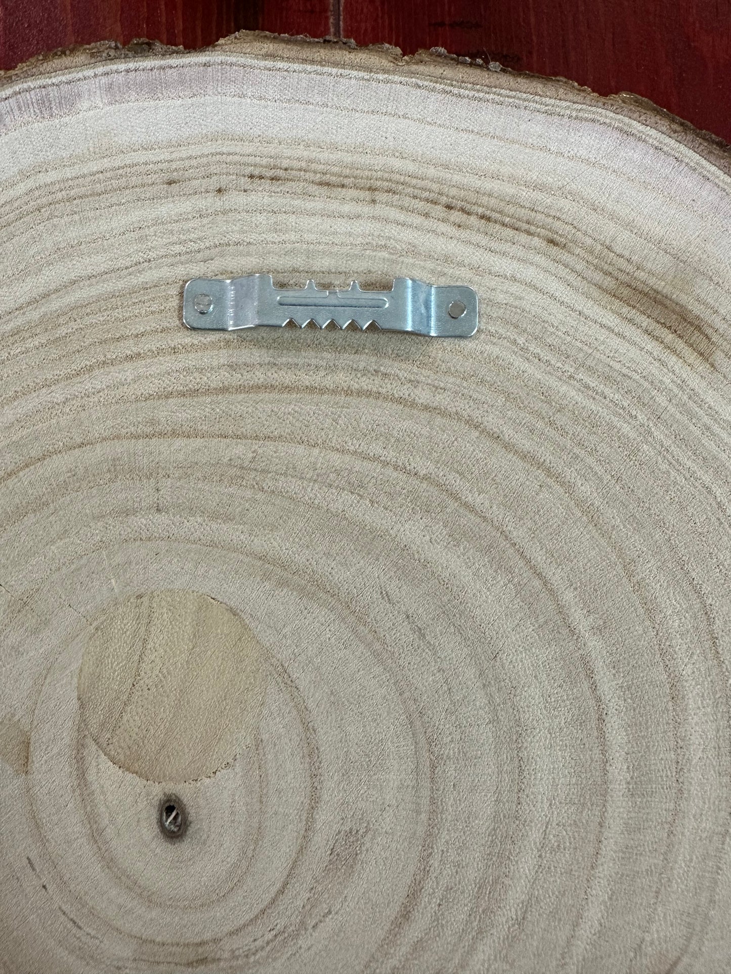 Close Up - Back Side Hardware View
Wall hanging hardware on wood round.