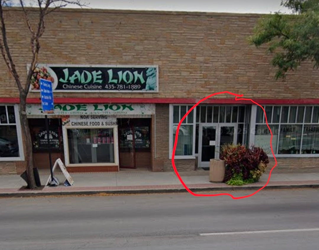 Uintah Basin custom apparel store front view with inviting entrance and vibrant plants.