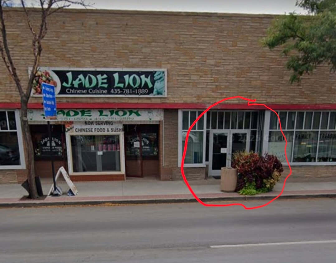Uintah Basin custom apparel store front view with inviting entrance and vibrant plants.