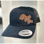 Close up Front View Black iris ink trucker hat Cursive Logo
