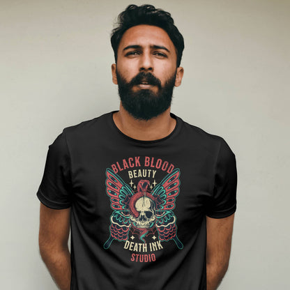 Man wearing a black t-shirt with a graphic design against a plain background