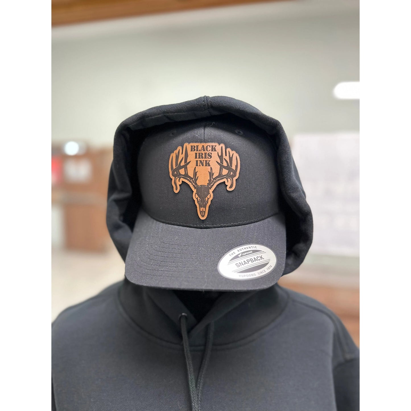 Black hat with Deer, leather patch in the center