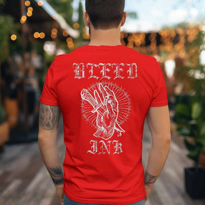 Back View
Person wearing a red t-shirt with white graphic design and text, 'Bleed Ink' standing outdoors.