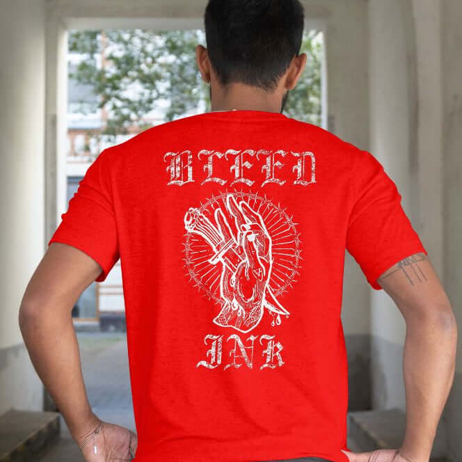 Red Bleed Ink T-Shirt Tattoo Inspired featuring bold tattoo artwork on a vibrant red shirt.