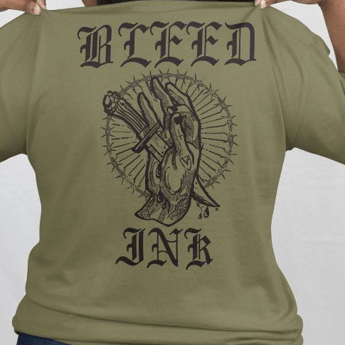Sage tattoo inspired Graphic Tee featuring bold 'BLEED INK' artwork on the back with a hand and tattoo elements.