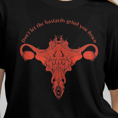 Close up - Front View
Black t-shirt with red graphic design and text on a plain background. 