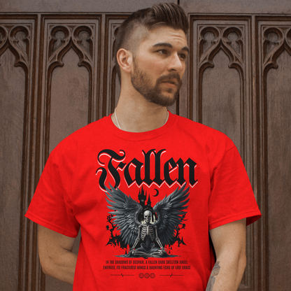 Man wearing a red 'Fallen' t-shirt with an angel design in front of a wooden door.