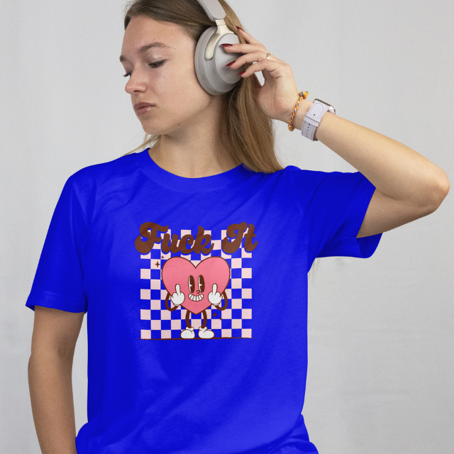 Front View - worn by a model
Person wearing a blue t-shirt with a graphic design "Fuck It" while listening to music with headphones on a plain background