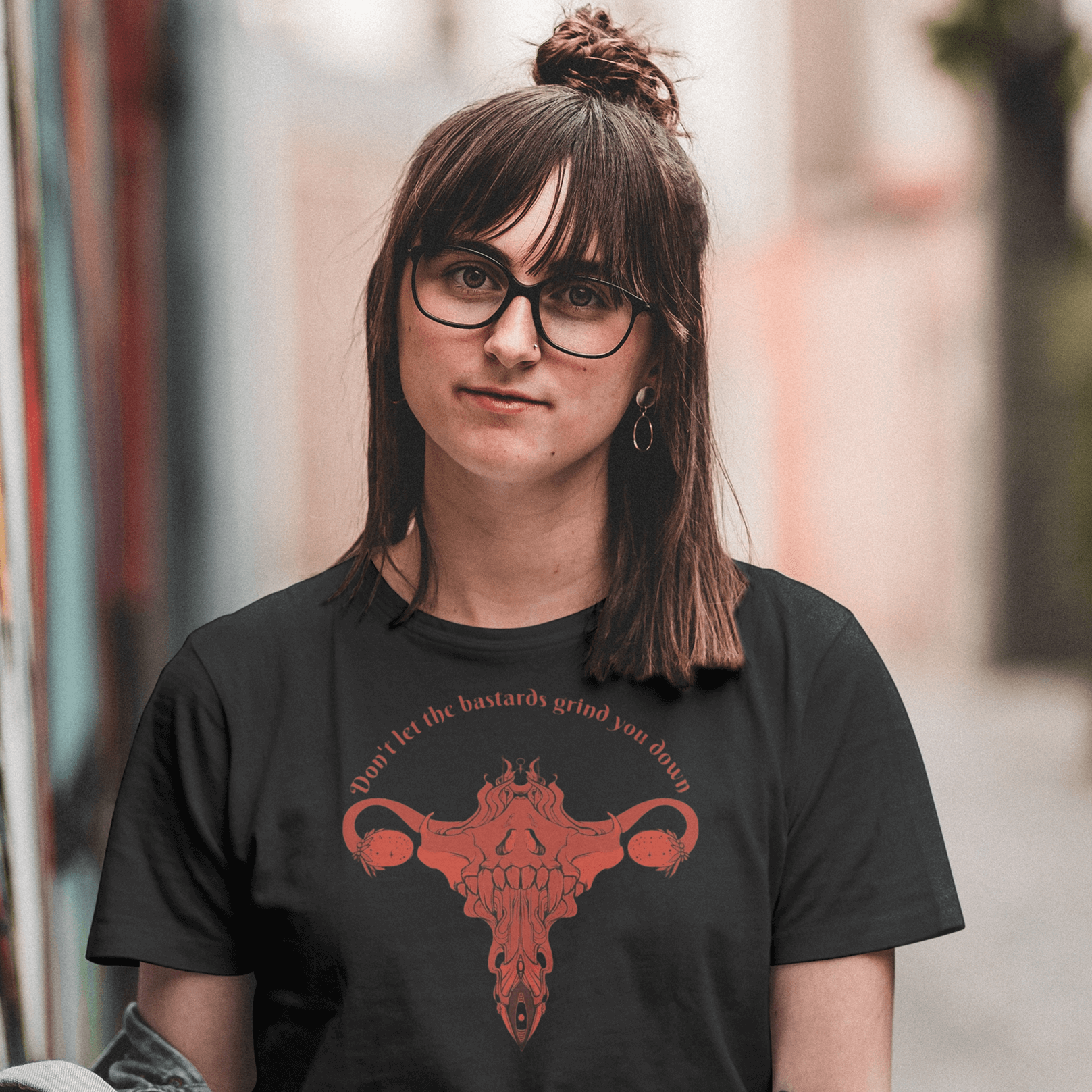 Person wearing a Don't Let Them Grind You Down Black Cotton T-Shirt