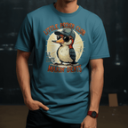 Person wearing a blue t-shirt with a penguin graphic and text 'Little Pecker Club' on a dark background