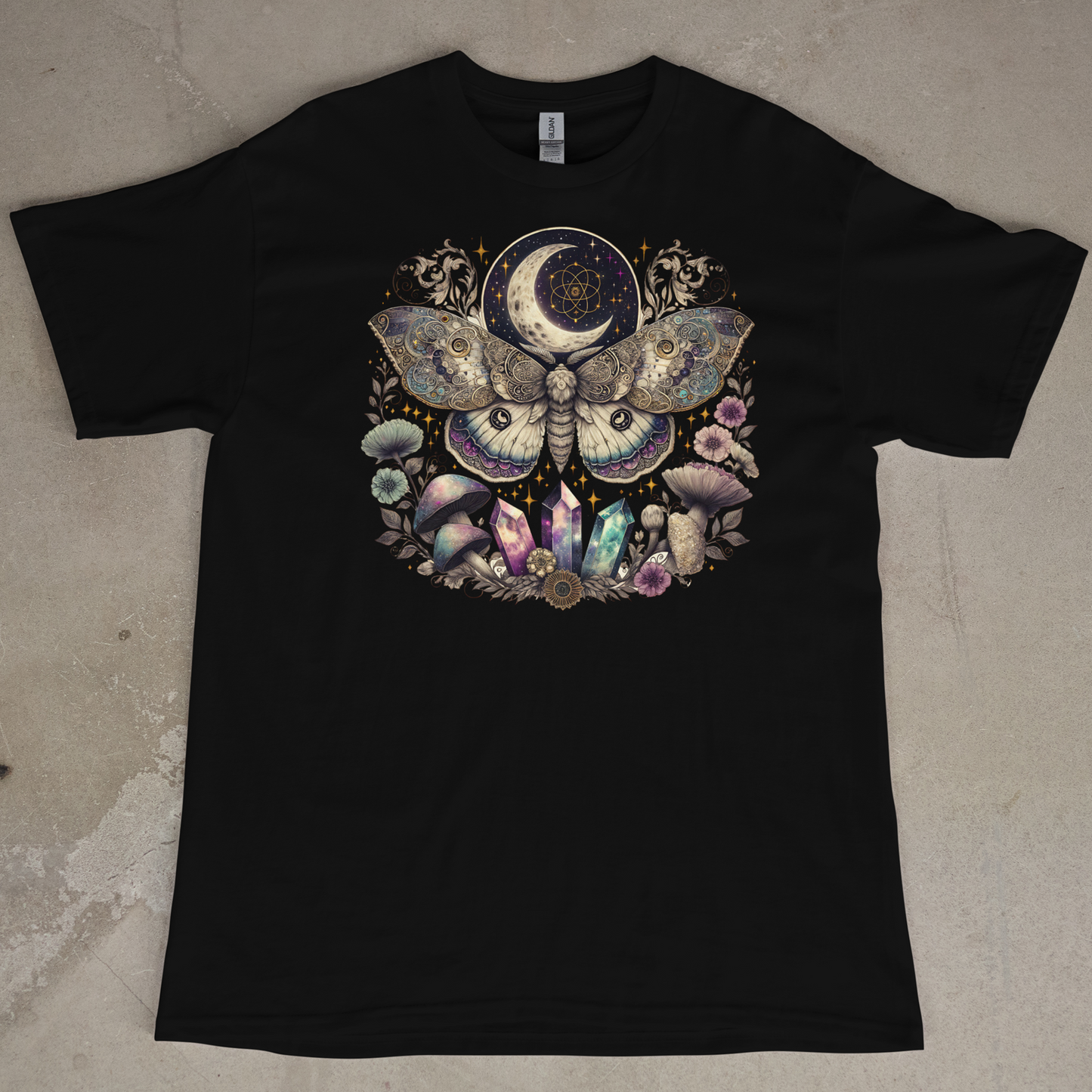 Black t-shirt with a colorful Moth and moon design on a textured surface