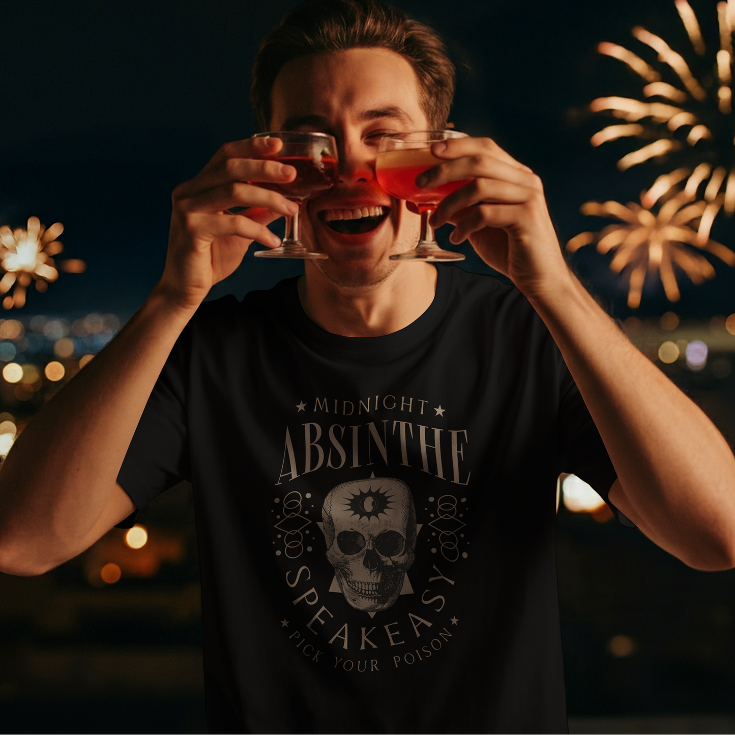 Person holding two glasses of red liquid with fireworks in the background