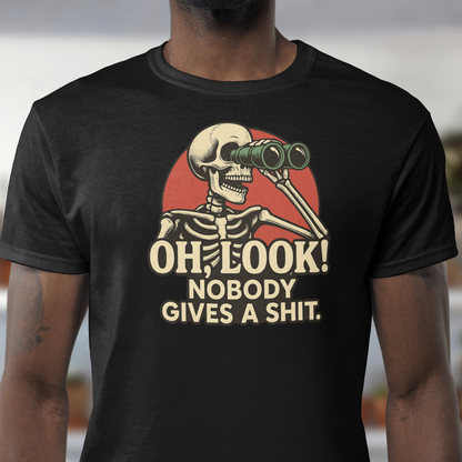 Person wearing a black t-shirt with a skeleton graphic and text outdoors.