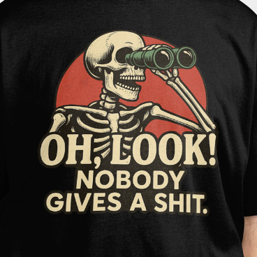 Close Up - Front View
Black t-shirt with a skeleton holding binoculars and text 'OH, LOOK! NOBODY GIVES A SHIT.'