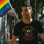 Man walking down a street holding a rainbow flag, wearing a black t-shirt with a graphic design.