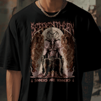 Person wearing a black t-shirt with graphic design in an urban setting