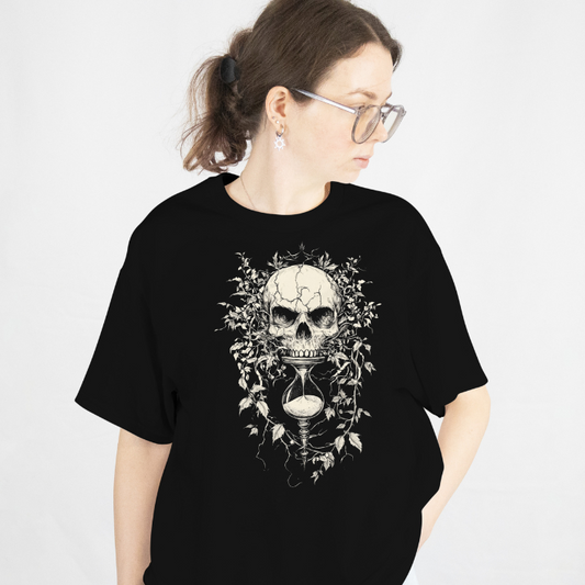 Front View
Person wearing a black t-shirt with a skull and hour-glass design on a white background