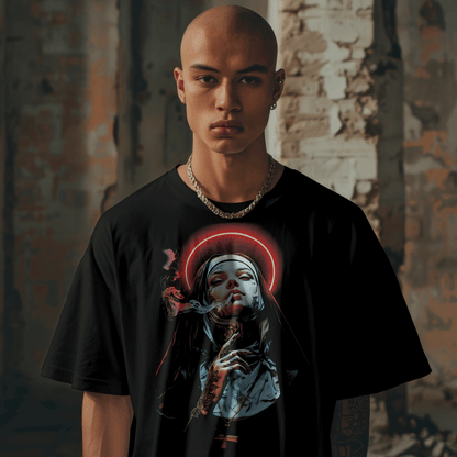Person wearing a black t-shirt with a graphic design in an urban setting