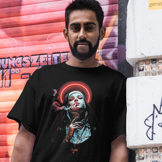 Front view worn by a model.
Man wearing a black t-shirt with a graphic design of a smoking Nun, in front of a colorful mural.