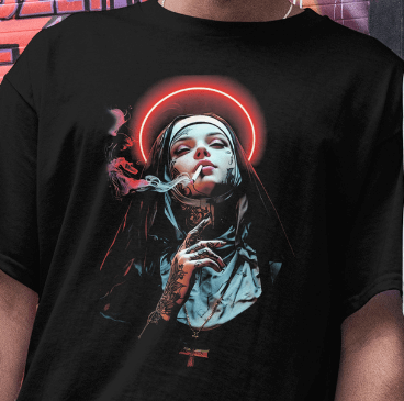 Close Up - Front View worn by Model.
Black t-shirt with a graphic design of a smoking Nun, being worn by person with tattoos.
