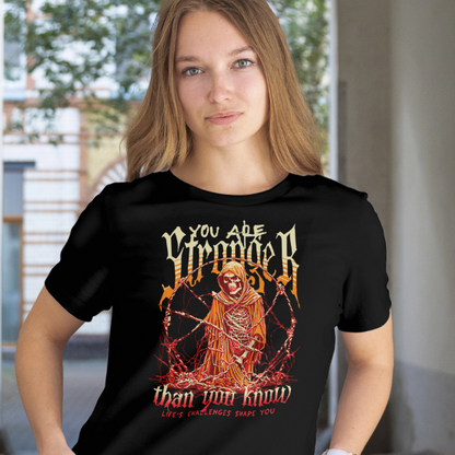 Front View
Person wearing a black t-shirt with a graphic design 'You Are Stronger' and text.