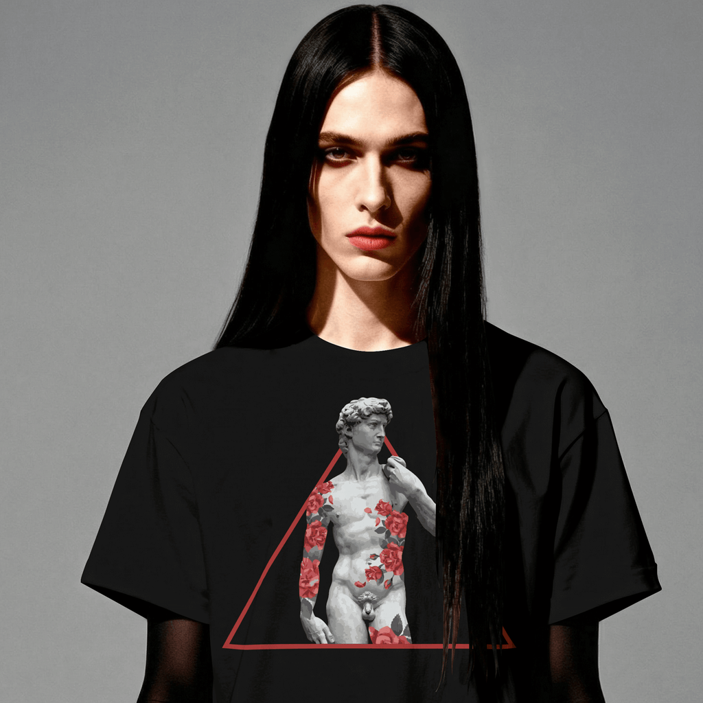Person wearing a black t-shirt with a graphic design on a gray background