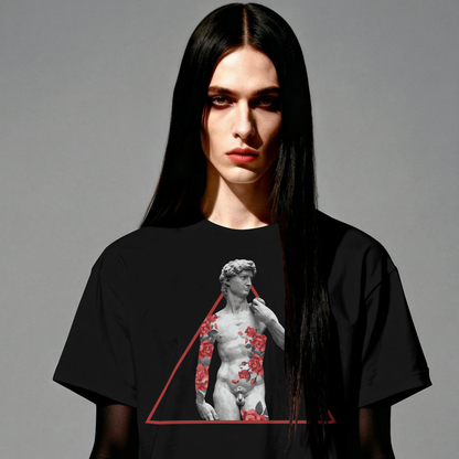 Person wearing a black t-shirt with a graphic design on a gray background