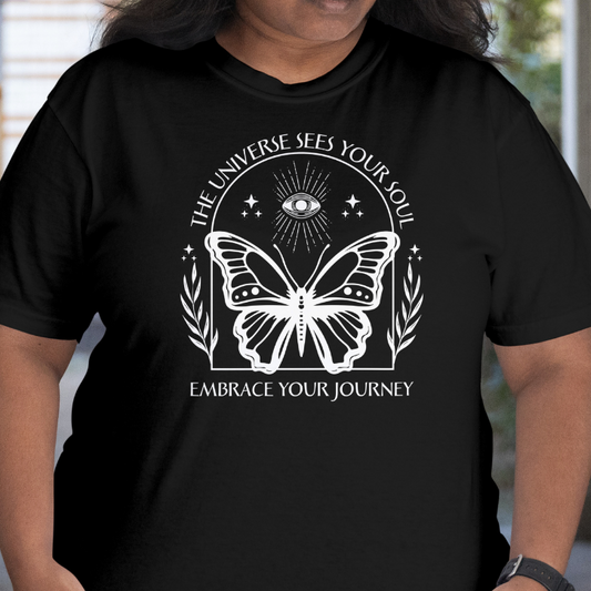 Front View 
Person wearing a black t-shirt with a butterfly design 'The Universe See's Your Soul' and text.