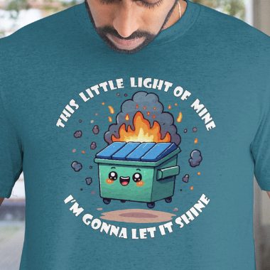 Close up of Graphic worn by a model.
Person wearing a teal t-shirt with a graphic of a dumpster fire and text.