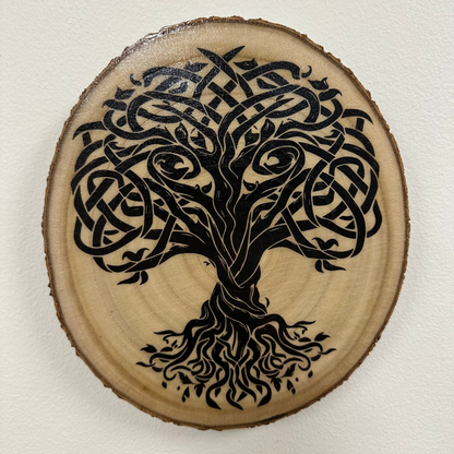Close Up - Top View
Round, Burch wooden slice with a black Tree Of Life  design on a white background