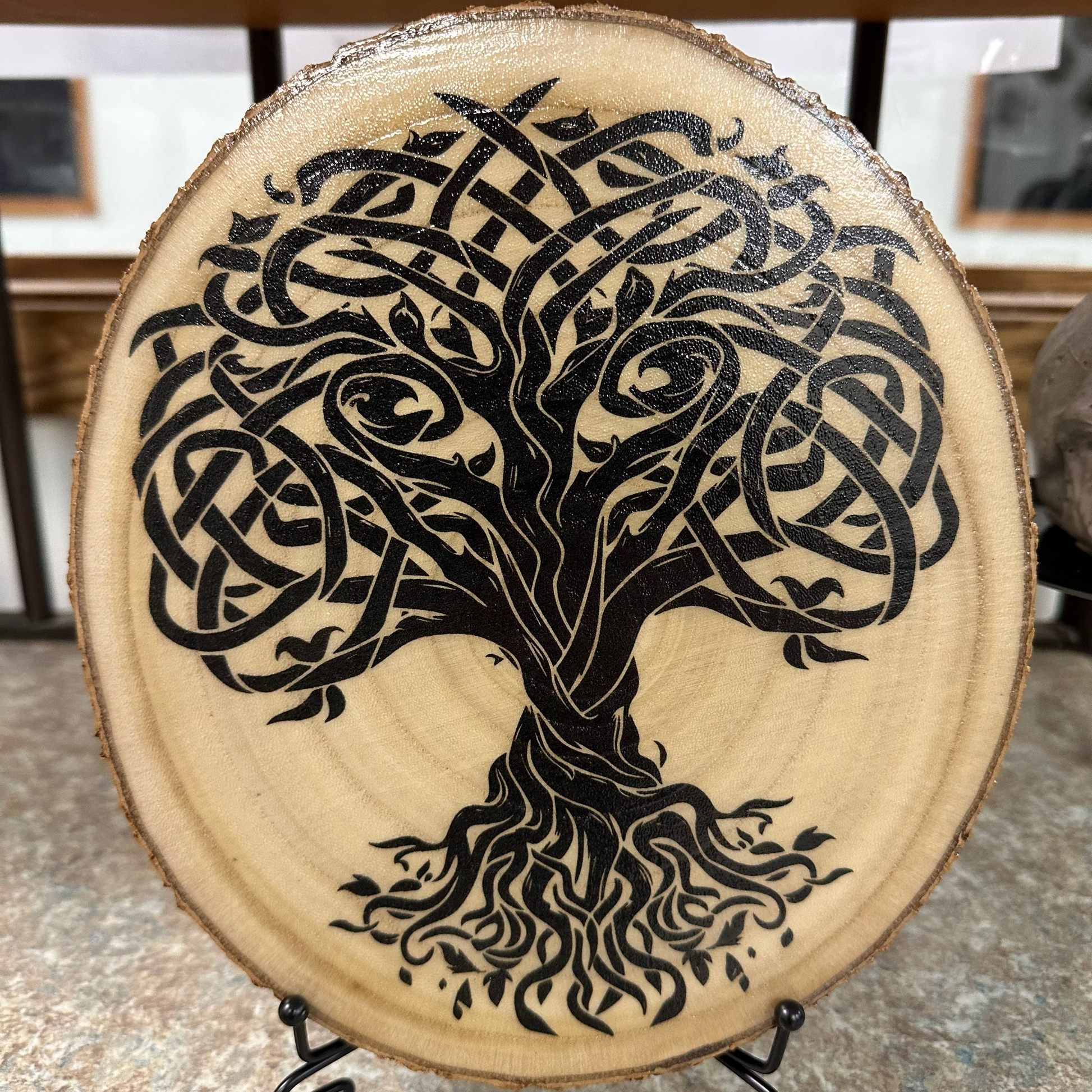 Close Up - Front View on a stand
Rustic-Round wooden plaque with a black tree Of Life design on a stand. 
