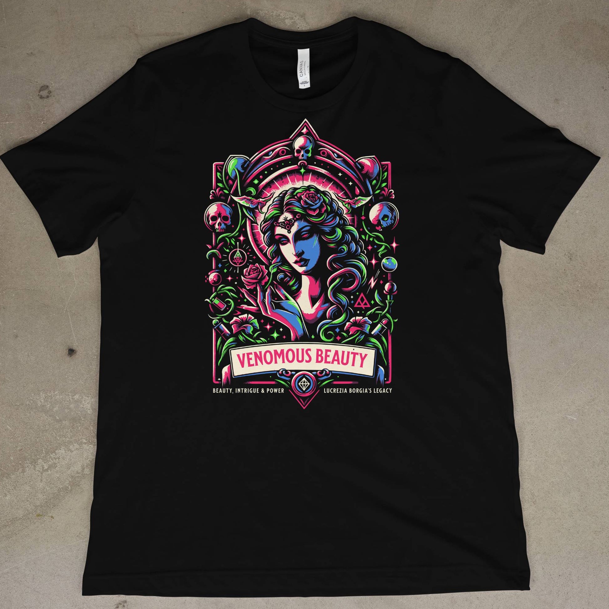 Black t-shirt with colorful graphic design on a concrete floor