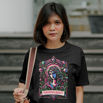 Woman wearing a black t-shirt with a colorful graphic design, standing outdoors.