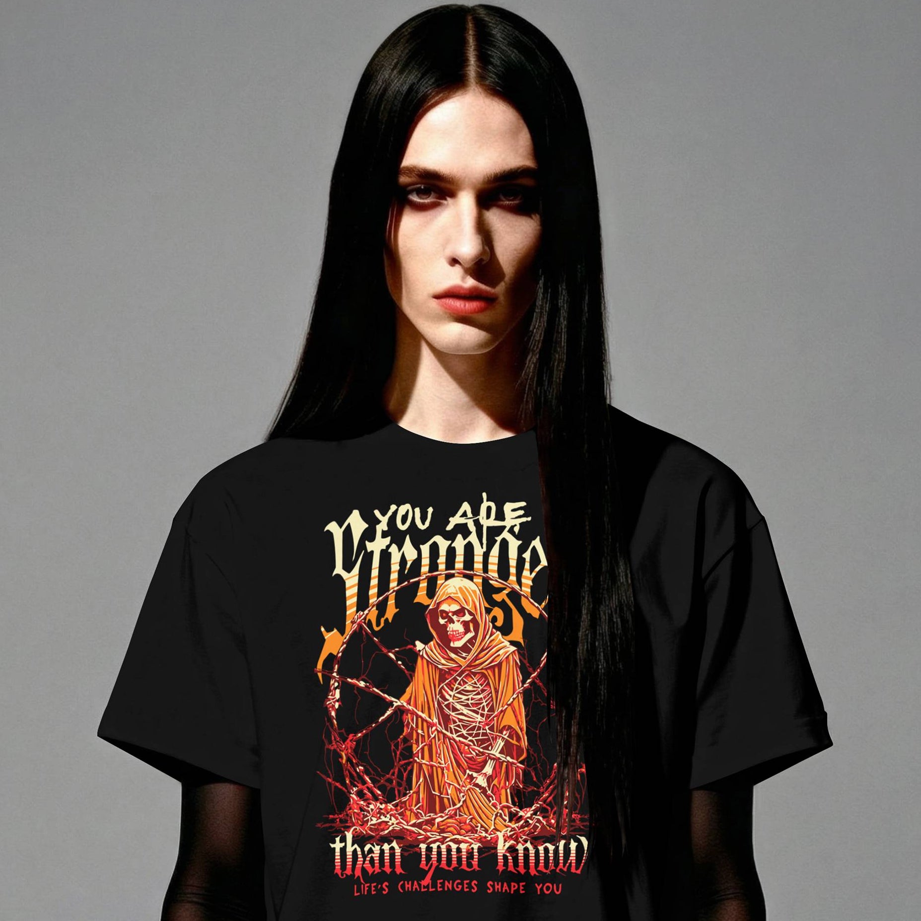 Person wearing a black t-shirt with a graphic design and text on a gray background