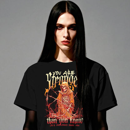 Person wearing a black t-shirt with a graphic design and text on a gray background